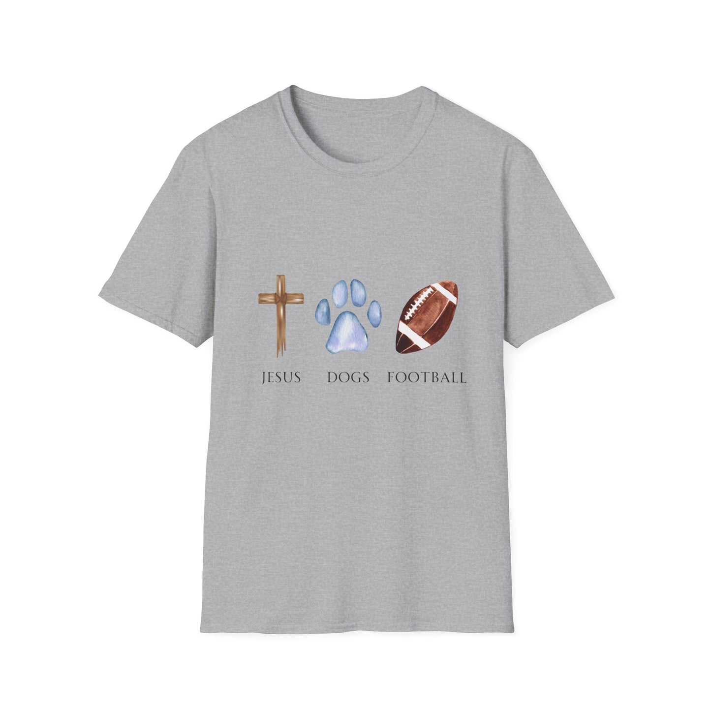 A person wearing a grey unisex t-shirt with graphics of a cross, a dog paw, and a football on it, standing on a field.
