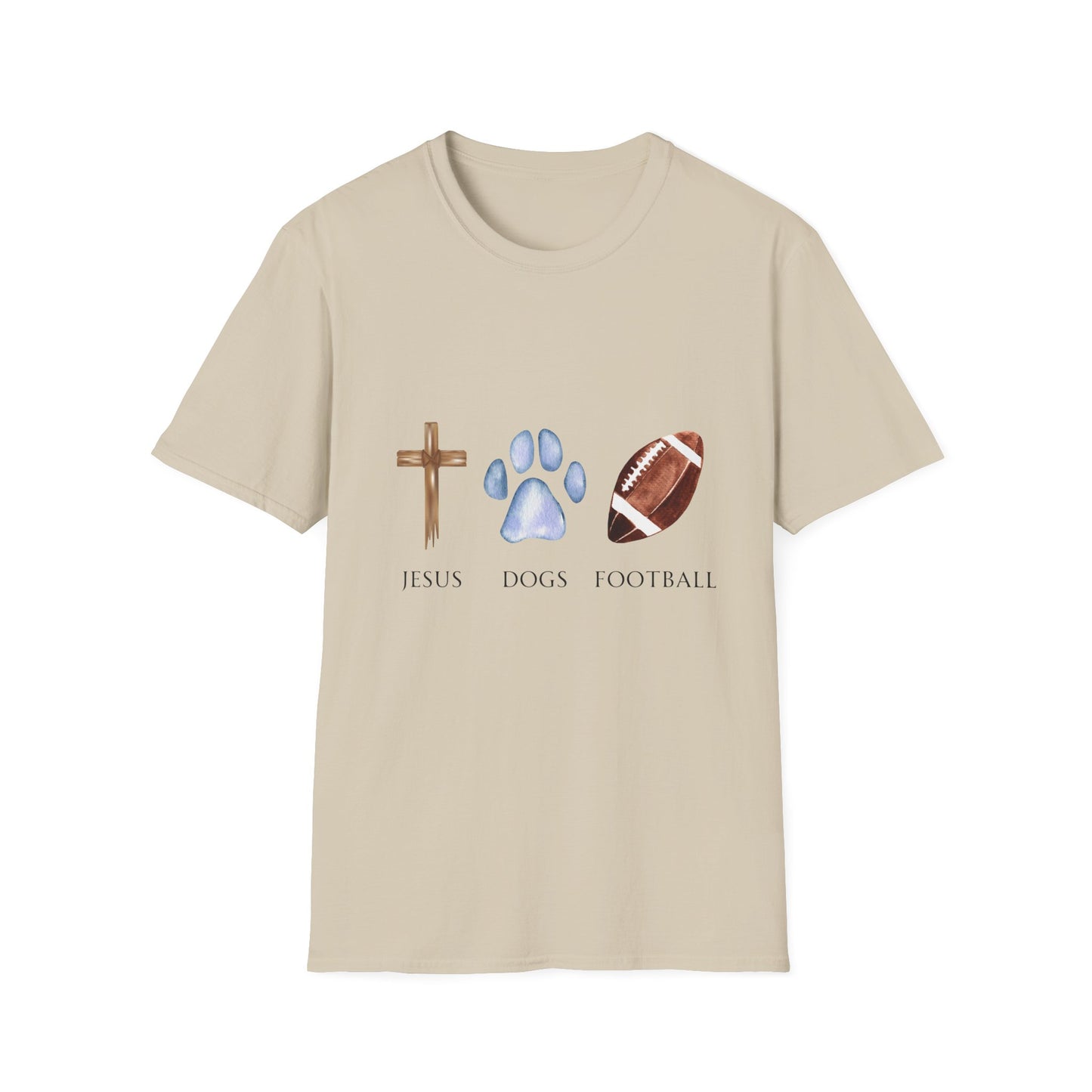 A person wearing a grey unisex t-shirt with graphics of a cross, a dog paw, and a football on it, standing on a field.