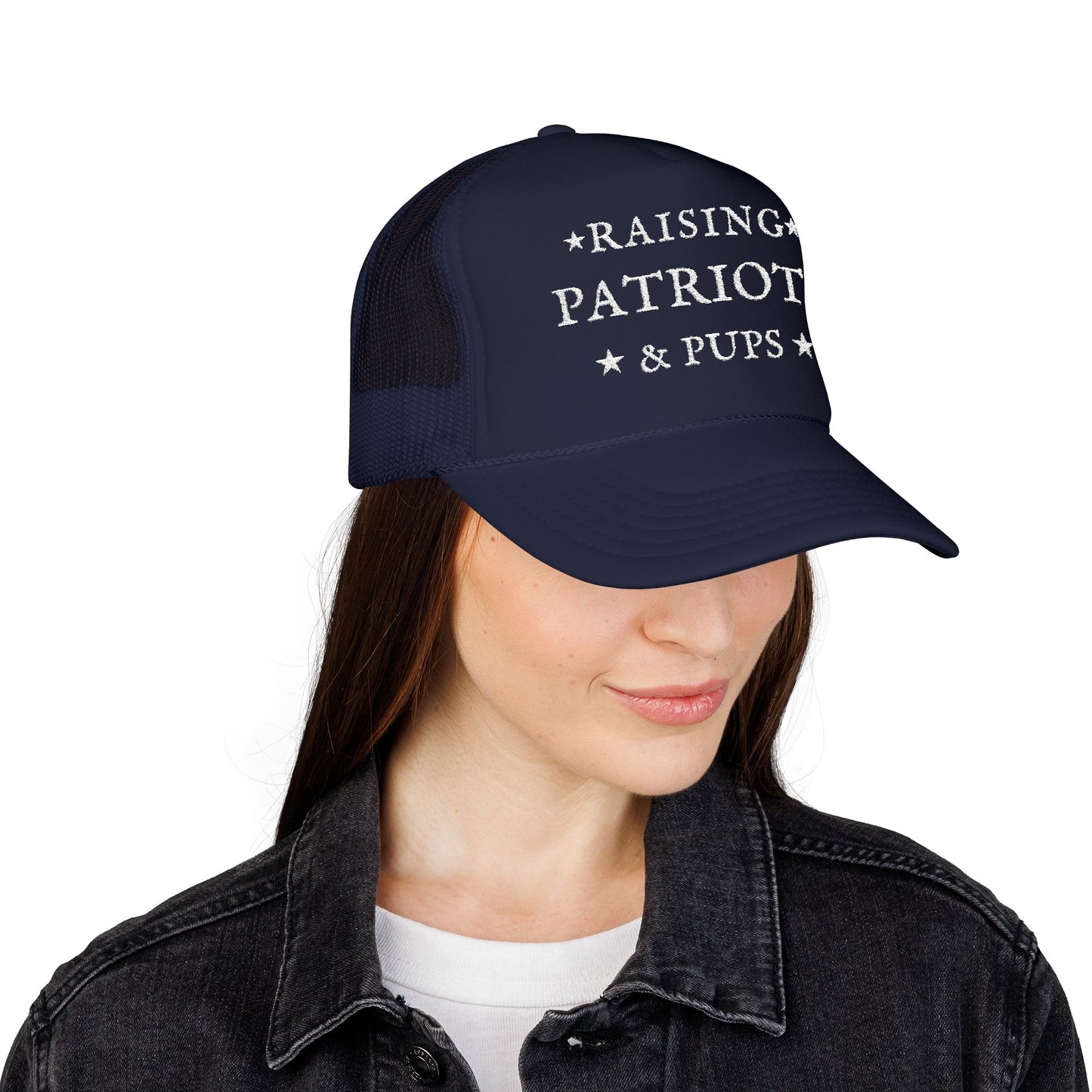 Person wearing a blue cap with Raising Patriots and Pups