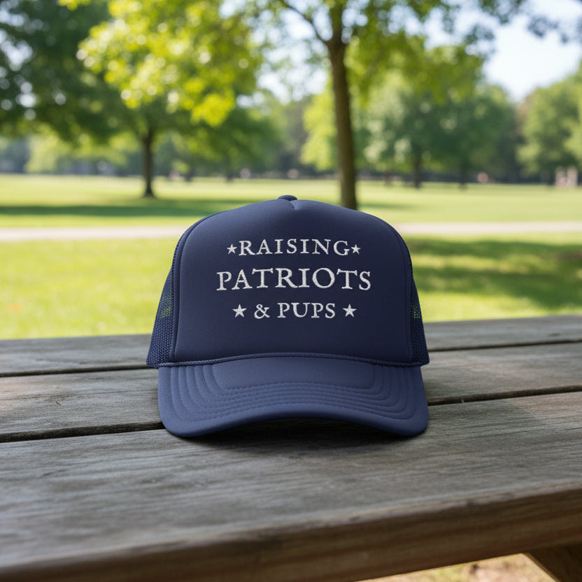 Navy Blue Trucker Hat with the words Raising Patriots and Pups