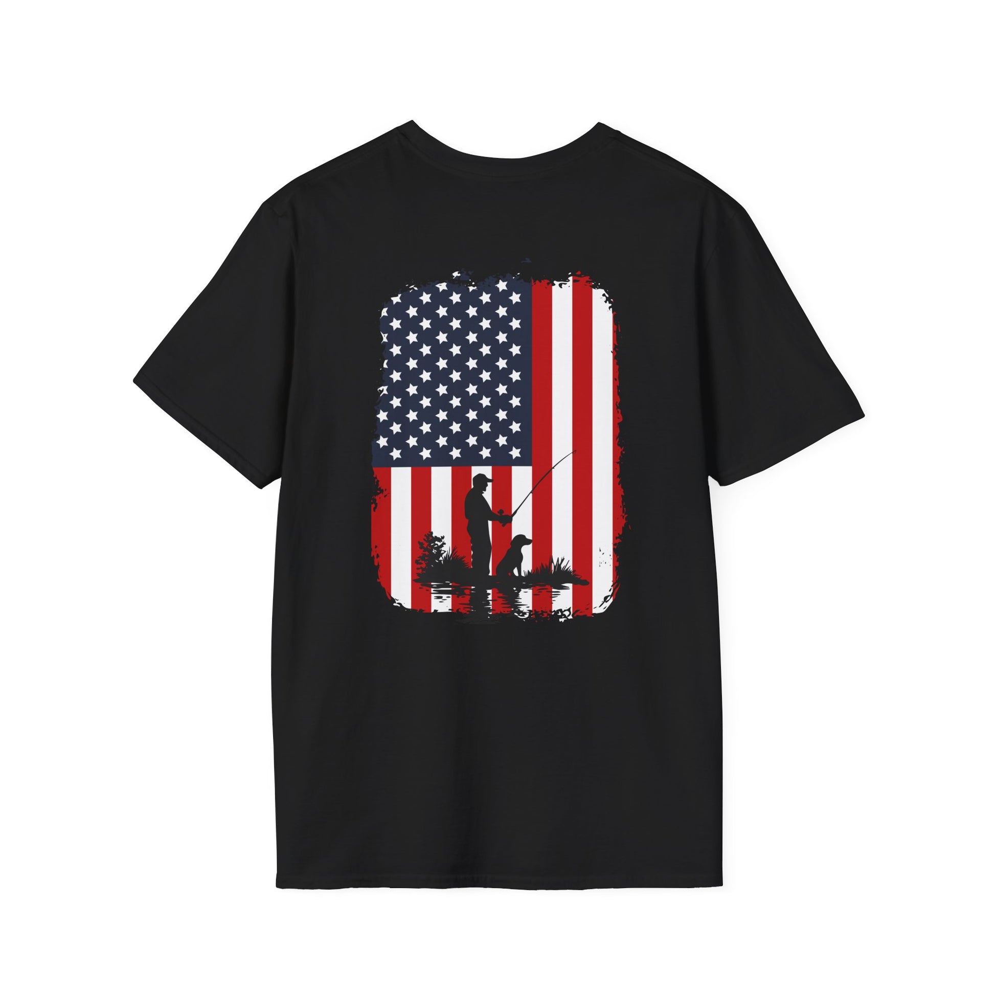 A person wearing a black American Flag Fishing Dog T-Shirt with a graphic of the US flag and a silhouette of a dog holding a fishing rod on the back. A dog is seated in the background.