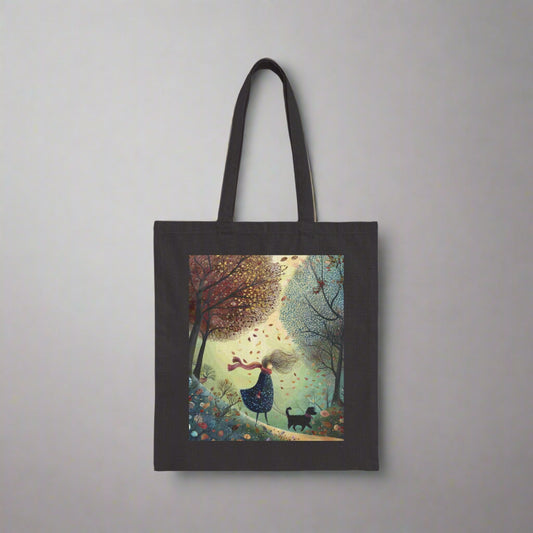 Black tote bag with a colorful autumn scene featuring a person and dog in a forest.