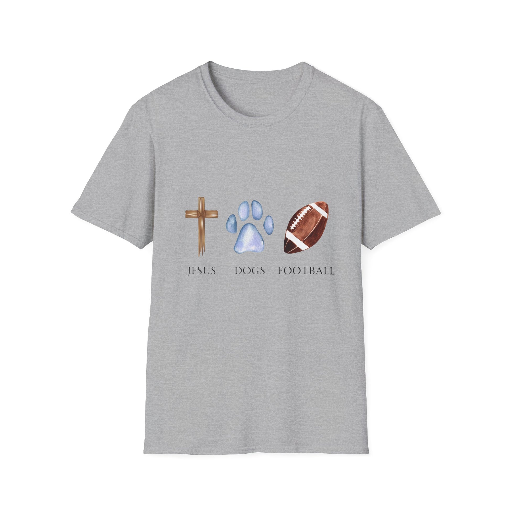 A person wearing a grey unisex t-shirt with graphics of a cross, a dog paw, and a football on it, standing on a field.