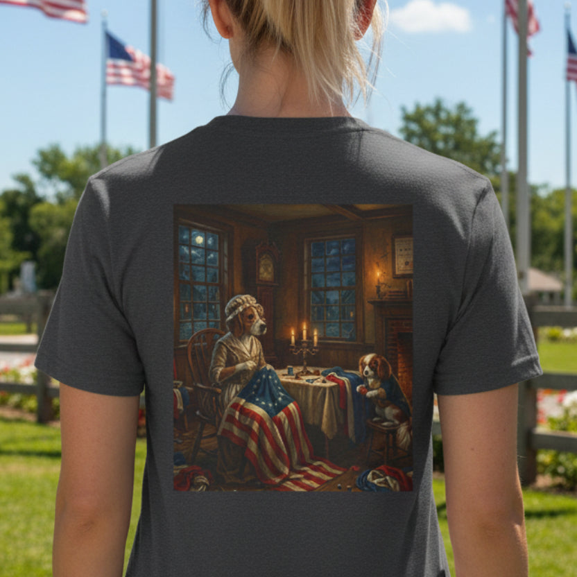 Dark Heather Grey t-shirt with a graphic of a dog Betsy Ross in a patriotic-themed scene on a patriotic background