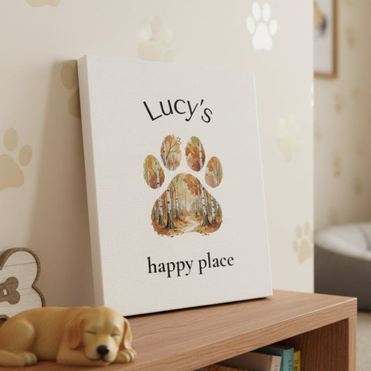 Canvas sign with a forest-themed paw print and 'Lucy's happy place' text on a white background