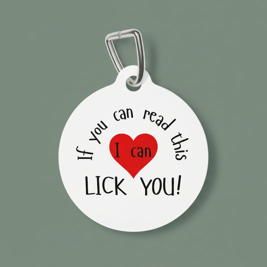 Pet tag with humorous text and red heart on a white background
